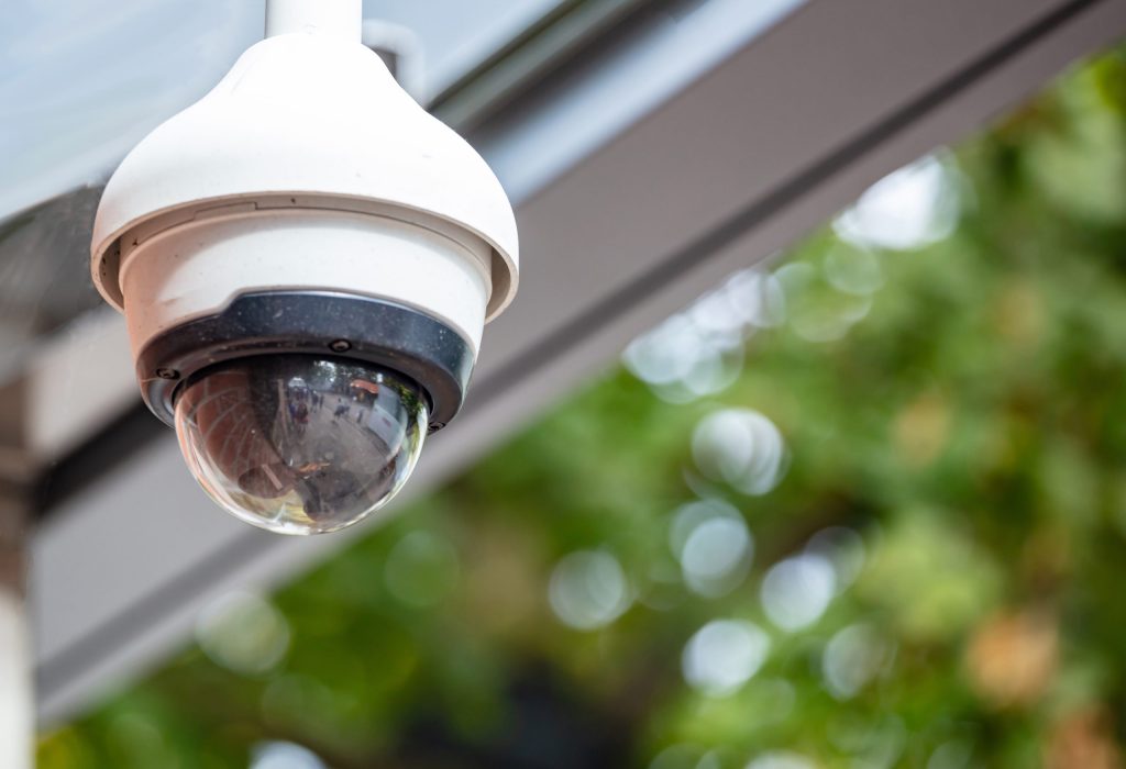 Security concept. Surveillance CCTV Camera on the roof, closeup view